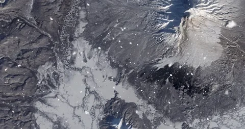 Ascending through falling snow over Kamchatka Peninsula, Russia. Two versions Stock Footage 268303867