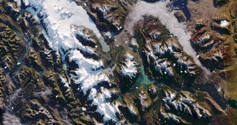 Ascending through falling snow over parts of the Patagonian alps. Two versions Stock Footage 268304487