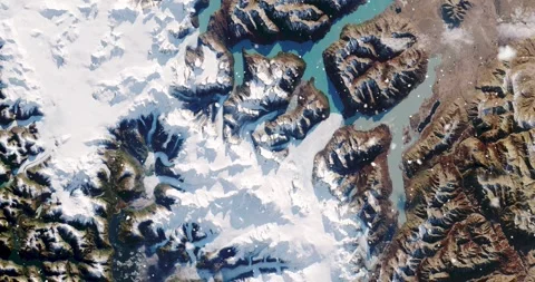 Ascending through falling snow over parts of the Patagonian alps. Two versions Stock Footage 268304502
