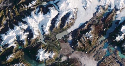 Ascending through falling snow over parts of the Patagonian alps. Two versions Stock Footage 268312573