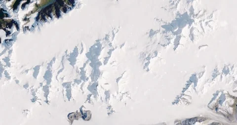 Ascending through falling snow over parts of the Patagonian alps. Two versions Stock Footage 268318026