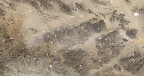 Ascending through falling snow over Monument Valley, Utah. Two versions Stock-Footage 268318027