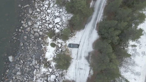 Ascending Top Down Drone Shot Of Person Sitting In Car At Finnish Lake Stock Footage 225829895