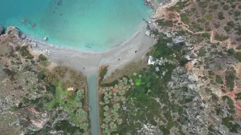 Ascending top-down view of Preveli beach and river mouth, Crete Stock Footage 346723791