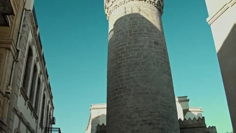 Ascending View of Historic Stone Tower with Clear Blue Sky Stock Footage 338244626
