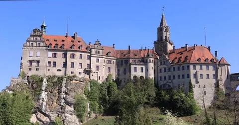 Ascending view of Sigmaringen castle on side of Danube river Stock Footage
