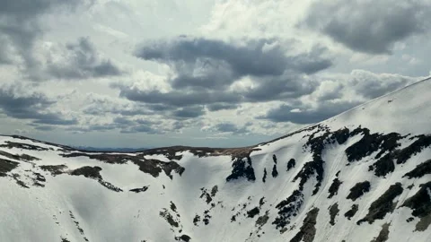 The ascent of a drone over a mountain range that opens up new horizons behind Stock Footage 242811812