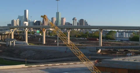 Ascent Over Houston Construction Zone Revealing City Skyline and Freeway Traffic Stock Footage 333284954