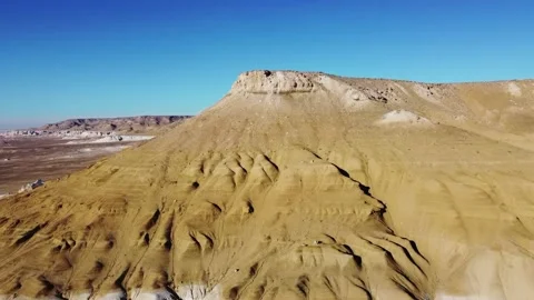 Ascent on a throne over a beautiful white mountain against a blue sky Stock Footage 238912816