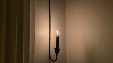 Ascetic candle in a dark room Stock Footage 345327844
