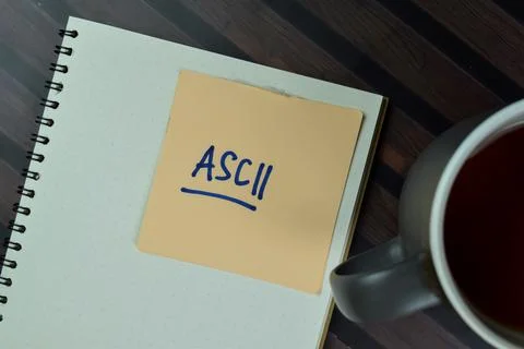 ASCII write on sticky notes isolated on Wooden Table. 스톡 사진