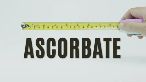 Ascorbate text or word and tape measure on a white background Stock Footage 302038411