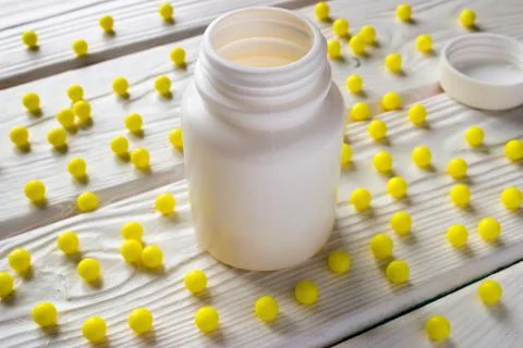 Ascorbic acid around the package on a white background Stock Photos