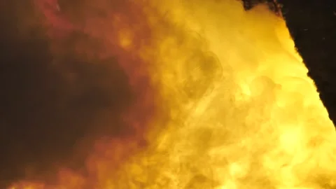 Ash and smoke from casting molten metal in furnace Stock Footage 141855648