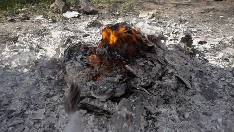 The ash of a campfire blows the wind in slow motion Stock Footage 158909863