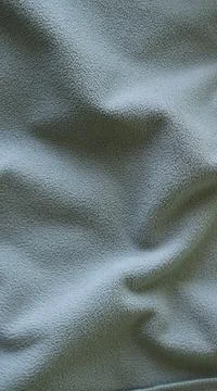 Ash-colored fluffy backdrop made of soft material Stock Photos