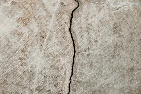 Ash-colored wall cracks in the small town Stock Photos