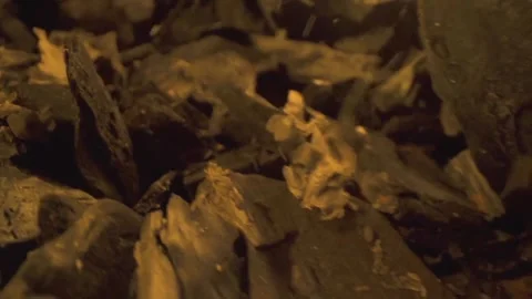 Ash descends upon the coal structure on the ground, symbolizing the Stock Footage 274272324