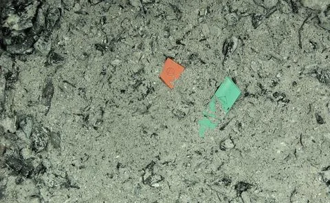 Ash from a fire with two keys of an electronic equipment Stock Photos