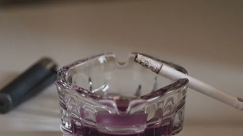 Ash table and cigarette on it Stock Footage 93487322