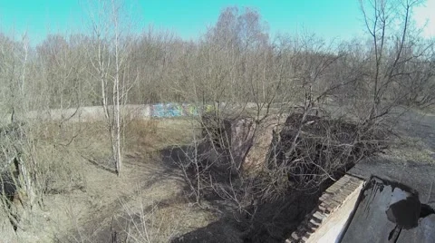 Ash of workshop edifice with graffiti on walls at spring day. Stock Footage 41763318