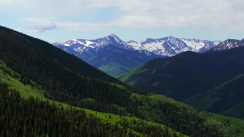 Ashcroft Mountain spring summertime morning blue sky clouds Aspen Mountain Ajax Stock Footage 316391485