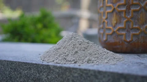 Ashes after cremation, very close-up on the background of the urn Stock Footage 247174889