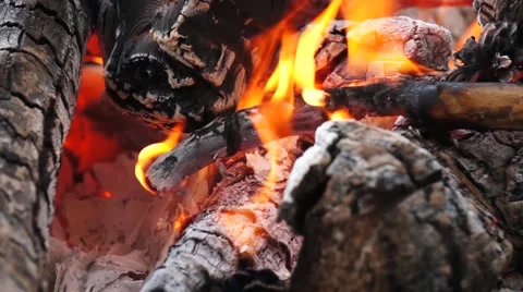 Ashes and flame on burning log in a fire Stock Footage 52372361