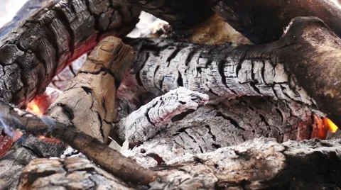 Ashes and flame on burning log in a fire Stock Footage 52372367
