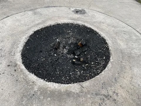 Ashes in a burn pit Stock Photos