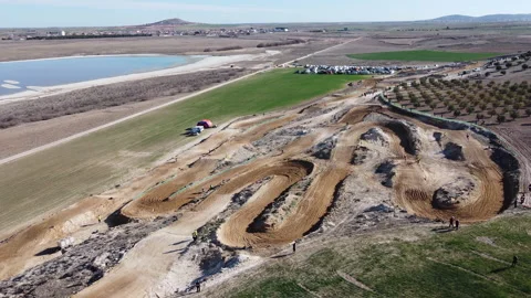 On the ashes planted with Spanish olives in the background you can see a wind fa Stock-Footage 240414157