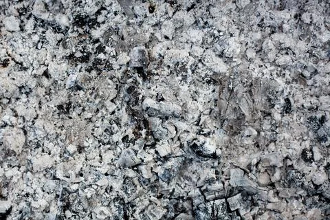 Ashes texture bacground. Wood ash in fireplace. Defocused charcoal cinder Stock Photos