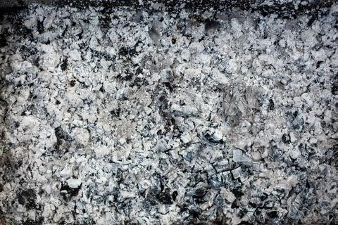 Ashes texture background. Wood ash in fireplace. Defocused charcoal cinder Foto stock