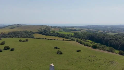 Ashey Down Sea Mark beacon drone rise over rolling farmland, Isle of Wight Stock Footage 339042792