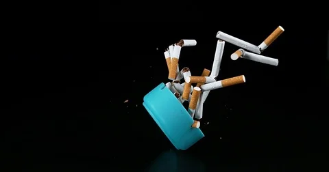 Ashtray and Cigarettes Falling against Black Background, Slow Motion 4K