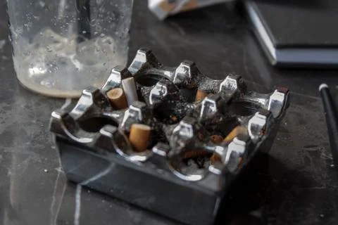 An Ashtray and Some Items on Table Stock-Fotos