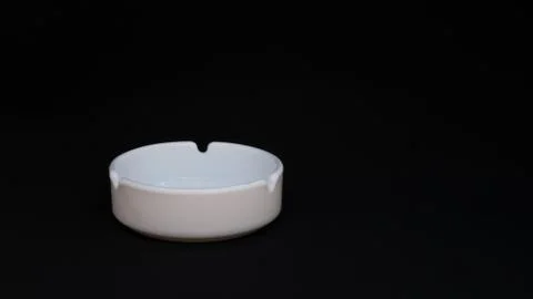 Ashtray on a black background Stock Photos