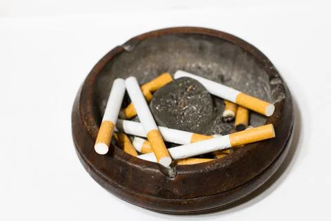 Ashtray with cigarettes on white background Stock Photos