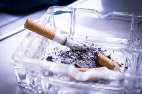 Ashtray with extinguished cigarettes full of ashes Stock Photos