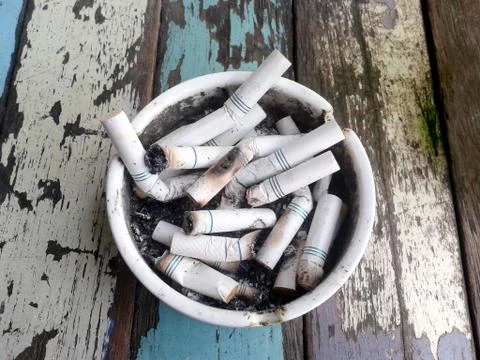 Ashtray full of butt cigarettes Stock Photos
