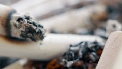 Ashtray full of cigarettes butts close-up, rusty depressive background. Stock Footage 155278451