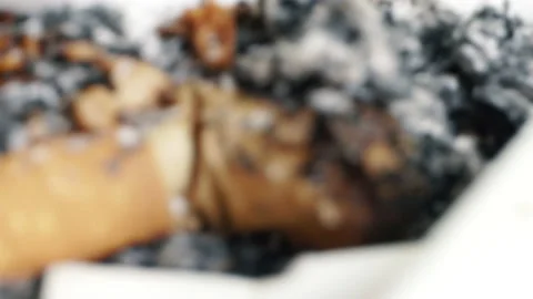 Ashtray full of cigarettes butts close-up, rusty depressive background. Stock Footage 155284113