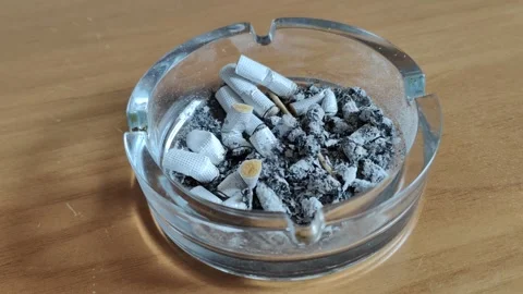 Ashtray full of cigars on desk Video stock 285732387