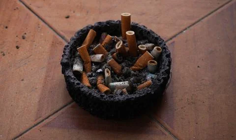 The ashtray is on the windowsill Stock Photos