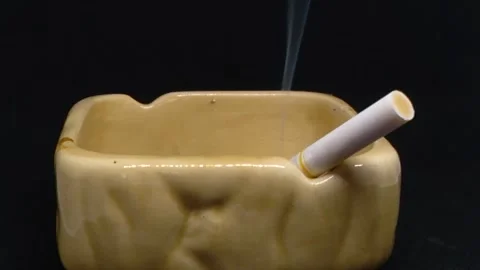 Ashtrays and cigarettes4 Stock Footage 259262156
