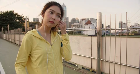 Asia athlete lady exercises using smartphone for listen to music while running. Stock Footage 121119738