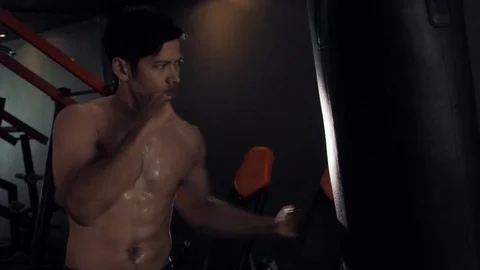 Asia Athletic Man Boxing Training stand Punching Bag In Gym. Stock Footage 106801149