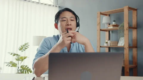 Asia businessman using computer laptop talk to colleagues in video call meeting. Stock Footage 152178469