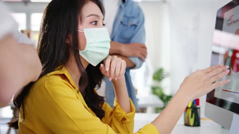 Asia businesspeople using computer presentation meeting brainstorming ideas. Stock Footage 135339877