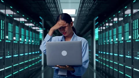 Asia Female Worker Headache When Use Laptop In Data Center Stock Footage 321990476